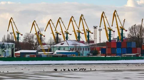 Harbor cranes, container ship terminal, cargo container yard Stock Photos