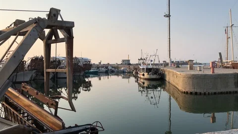 Harbor dock at sunset in calm day with calm sea Stock Footage 114761696
