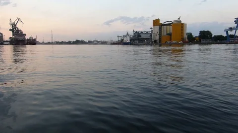 Harbor Docks Cranes and Cargo Ships at Sunset Stock Footage 102937282