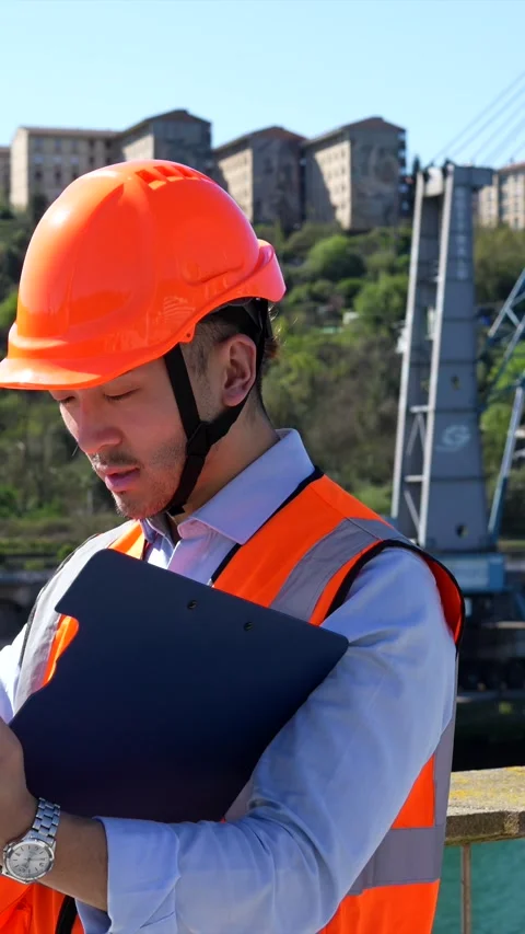 Harbor engineer inspecting shipping documents at port Stock Footage 333731609