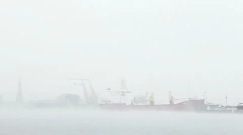 Harbor in mist unloading ship and moving cranes part3 動画素材 9651840