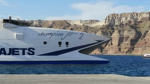 Harbor Ormos Athinios at Santorini Isle (Greece). Catamaran ferry reaching in 스톡 동영상 76948293
