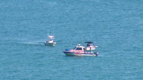 Harbor Patrol Boats close to stranded boat  Stock Footage 7753554