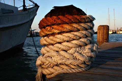 Harbor post with rope Stock Photos