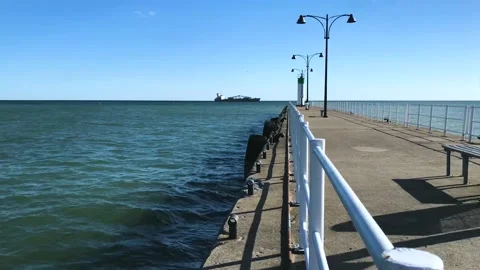 Harbor with a ship in the horizon Stock Footage 223394712