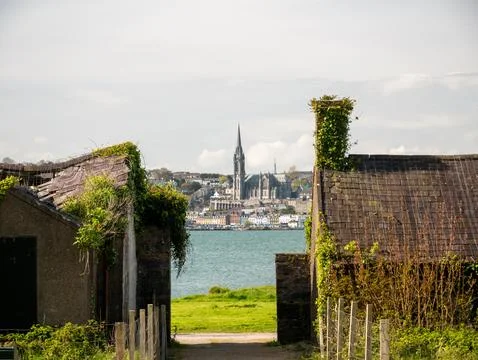 Harbor town view framed by rustic cottages Stock Photos
