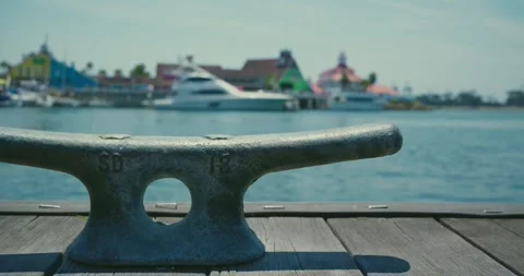 Harbor View with Dock Cleat and Colorful Waterfront 스톡 동영상 323589568