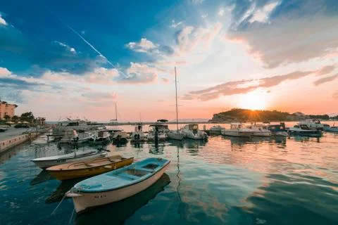 Harbor view sunset with boats Stock Photos