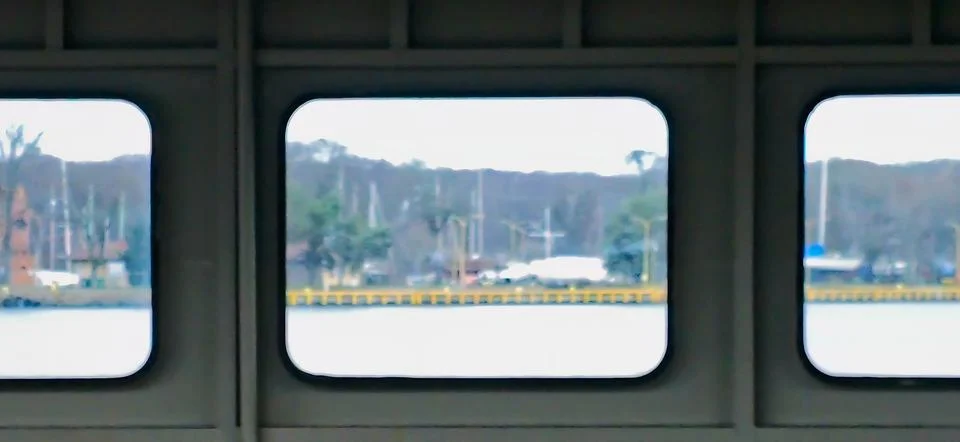 Harbor view through ferry windows Stock Photos