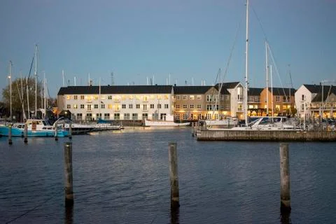Harbour with boats and yachts in the background Stock Photos