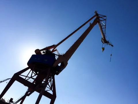 Harbour crane on the dock Stock Photos