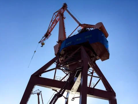 Harbour crane on the dock Stock Photos