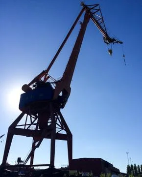 Harbour crane on the dock Stock Photos