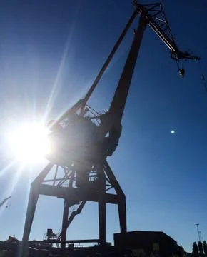 Harbour crane on the dock Stock Photos