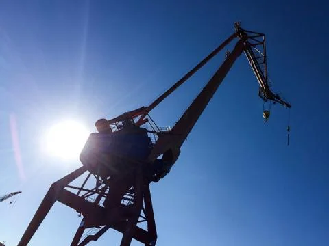 Harbour crane on the dock Stock Photos
