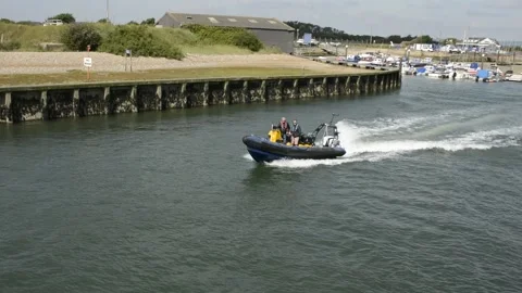 Harbour Master speedboat moving down river at Littlehampton, West Sussex, UK Video stock 162912405