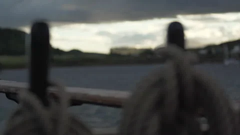 Harbour at sunset from sailing ship, rack focus Stock Footage 306960155