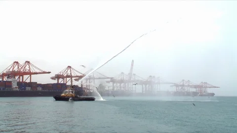 Harbour tug during firefighting exercise in a port in Oman. Stock Footage 90223247