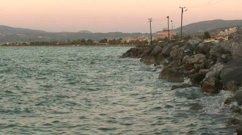 Harbour wall with beach in background Stock Footage 85405