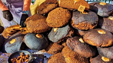 Hard Baked Artisan Loaf of Bread With Crust Texture in Bakery Display Vidéo 320887517