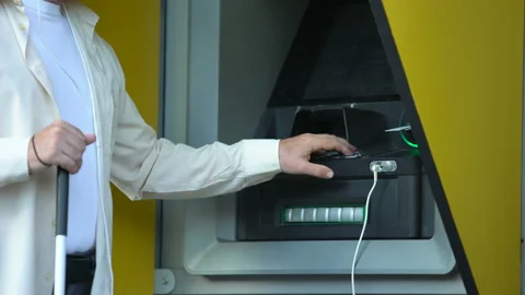 Hard for blind man enter code into talking atm, vile passerby stealing bank card Stock Footage 113521763