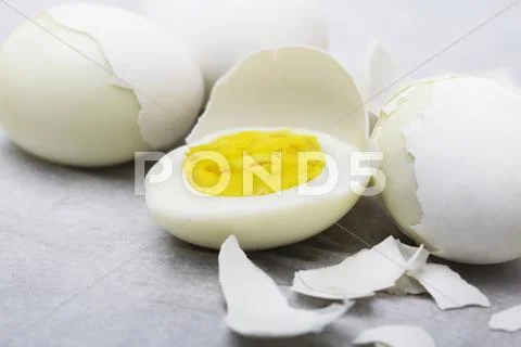Hard Boiled Cage Free Eggs; Some Partially Peeled; One Half Stock Photos