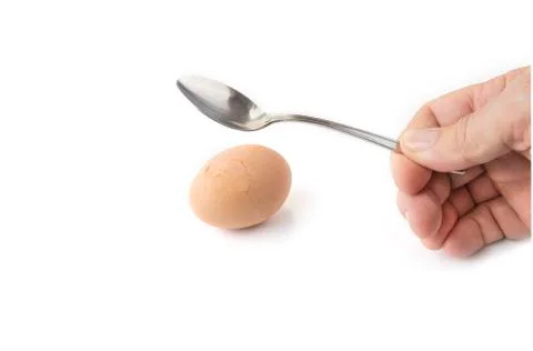 Hard boiled egg break shell with spoon Stock Photos