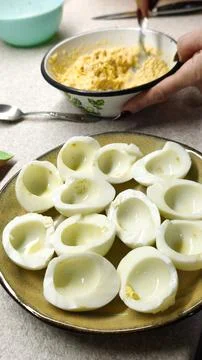 Hard-boiled egg halves prepared for filled Stock Photos