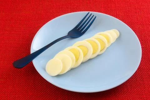 Hard boiled egg slices Stock Photos