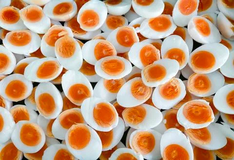 Hard boiled eggs cut in half, placed on top of each other, ready to serve. Stock Photos
