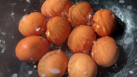 Hard-boiled eggs in hot, bubbling water. A simple egg-boiling. Stock Footage 347120145