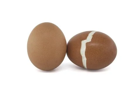 Hard-boiled eggs, one of which broke during the boiling process, isolated on a Stock Photos