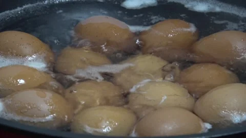 Hard boiling eggs hot pot close up. Video stock 312931516