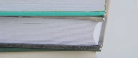 Hard book covers and sheets side-view anamorphic 4K scope video Stock Footage 321858138