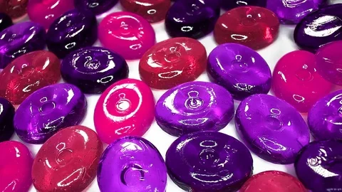 Hard candy candies closeup texture rotating video background Stock Footage 113143651