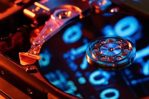 A hard disk with an abstract reflection of the binary code Stock Photos