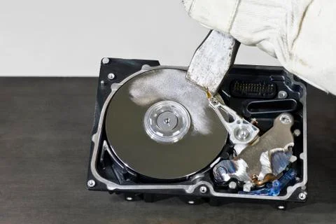 Hard disk and chisel Stock Photos