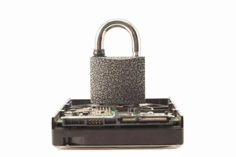 Hard disk and padlock on a white background. The lock is locked Stock Photos