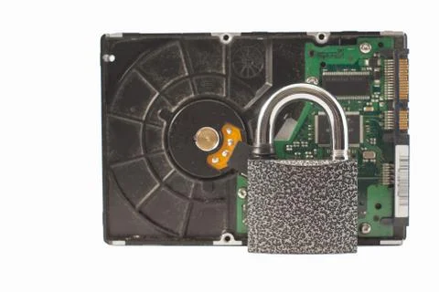 Hard disk and padlock on a white background. The lock is locked Stock Photos