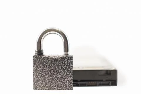 Hard disk and padlock on a white background. The lock is locked Stock Photos