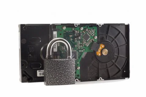 Hard disk and padlock on a white background. The lock is locked Stock Photos