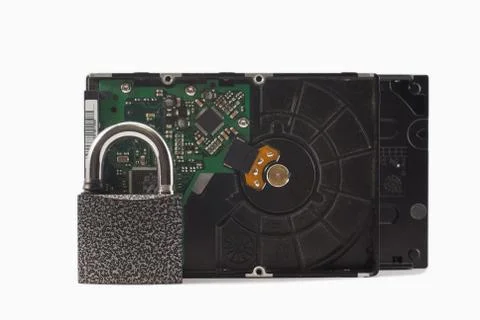 Hard disk and padlock on a white background. The lock is locked Stock Photos