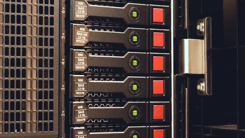 A hard disk array blinks showing read / write activity on a cloud server Stock Footage 104744181