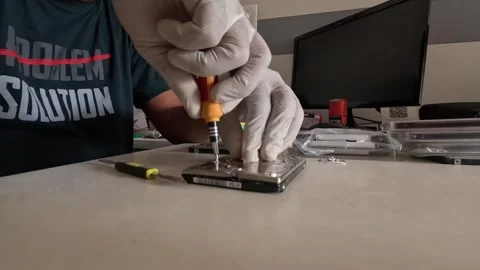 Hard disk is being restored by a computer technician Stock Footage 247818101