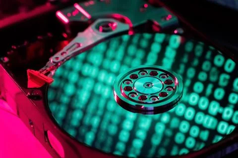 On the hard disk, the binary code is displayed in green numbers 스톡 사진