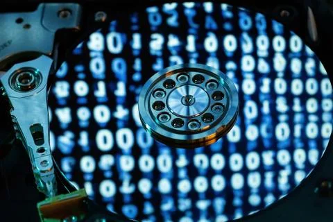 A hard disk with a blue binary code 스톡 사진