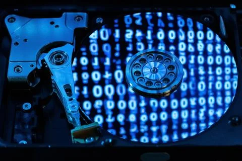 A hard disk with a blue binary code Foto stock