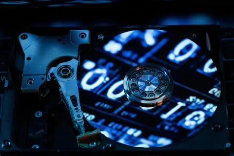 A hard disk with a blue binary code 写真素材