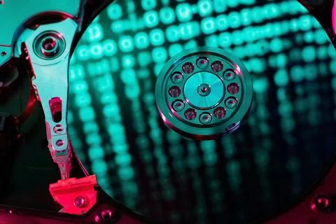 A hard disk with a blue binary code 库存照片