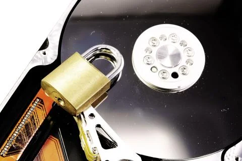 Hard disk with a closed padlock as a concept for computer data security on a  Foto stock